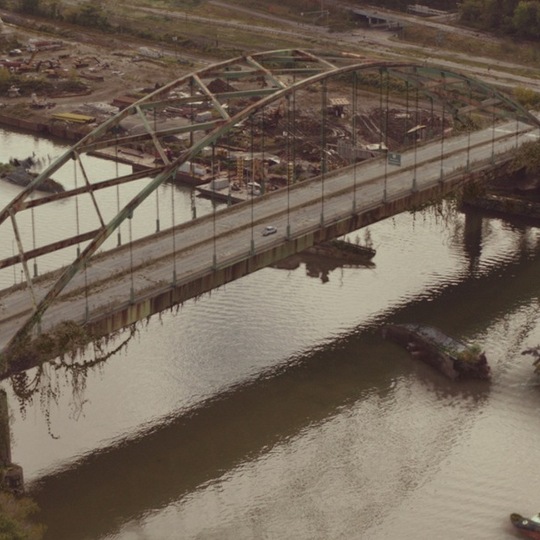 decaying bridge in post-apocalyptic world from 'The Last of Us'