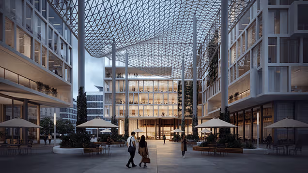 Architectural visualization of a sunlit public atrium beneath a geometric glass roof.