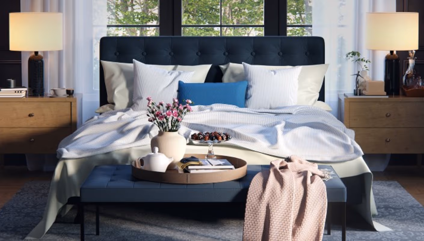 Sunlit bedroom render with layered fabric, soft shadows and tactile materials.